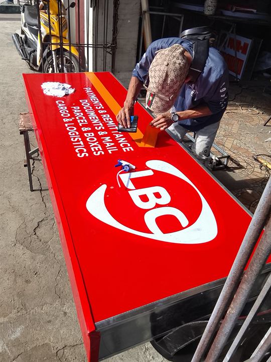 LBC red lightbox being finished in the Signstar workshop